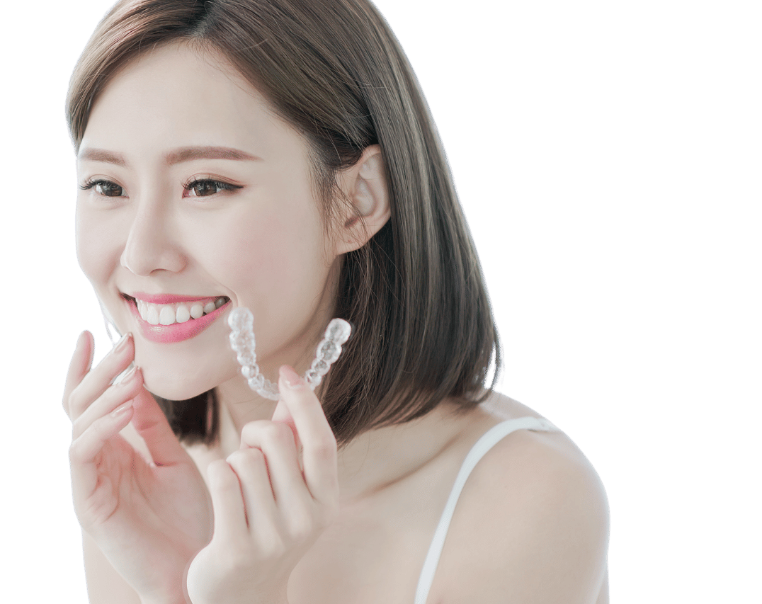 Woman Fitting Angel Aligners Onto Her Teeth - Angel Aligner Singapore